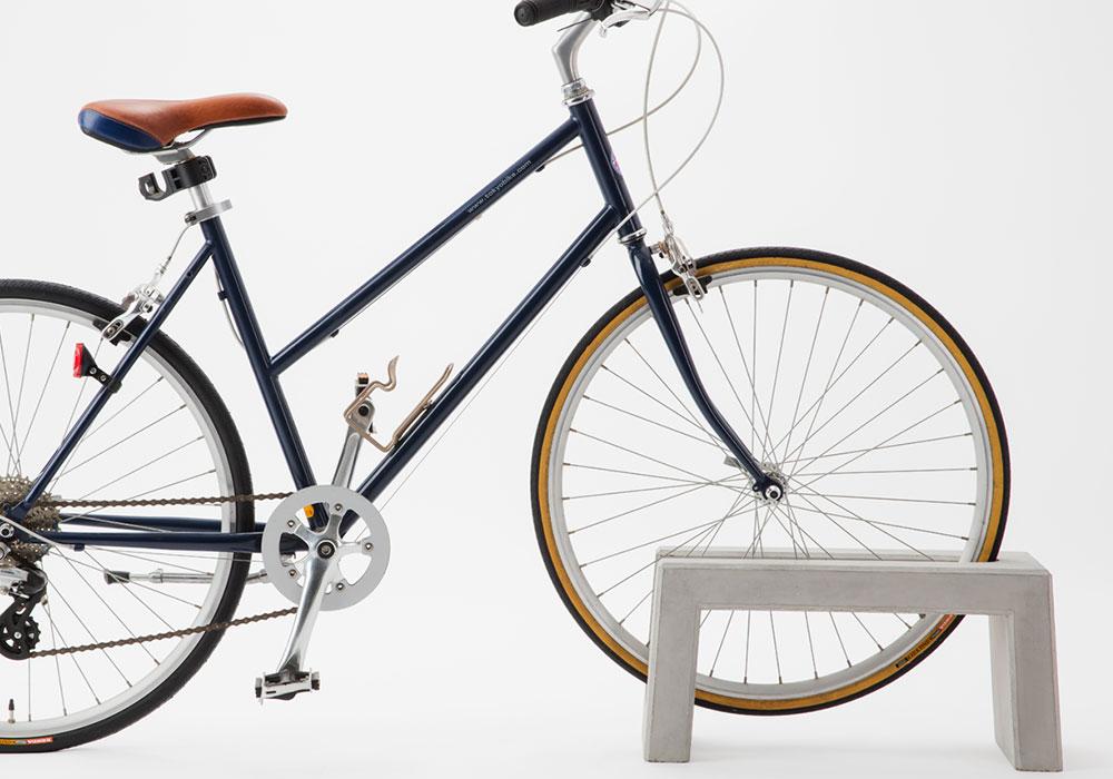 Coco concrete bicycle parking stand - bicycle parked, side view
